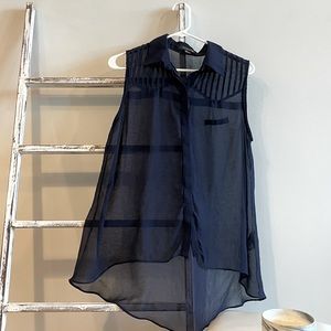 Navy sheer sleeveless blouse with faux left pocket and shoulder detailing